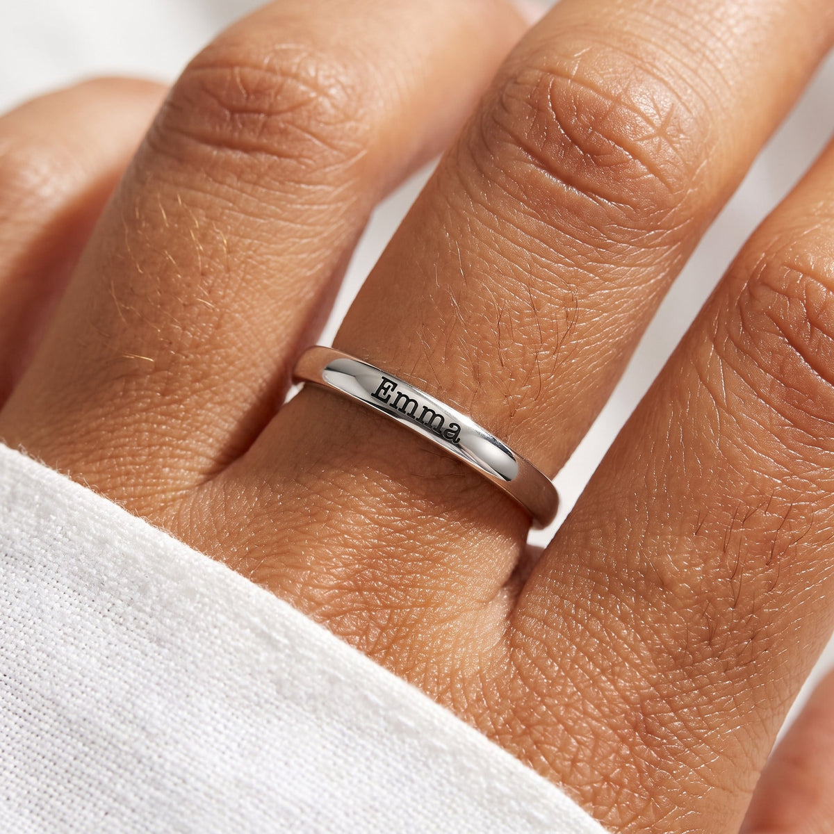 Tiny Stackable Name Ring – Silver – worn, close-up